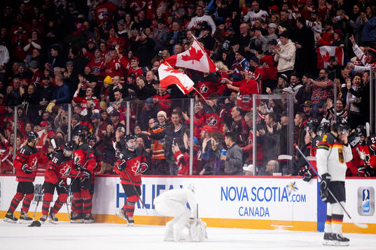 Shane Wright and Connor Bedard of Canada celebrate the 5-1