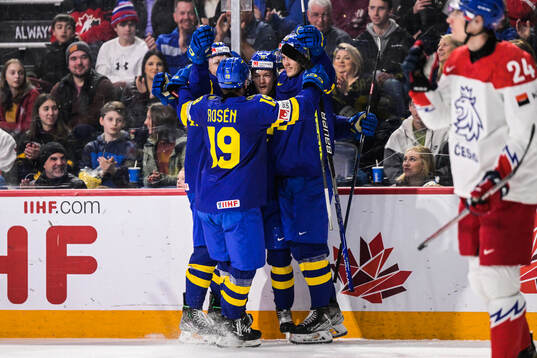 Fabian Wagner of Sweden celebrates with Isak Rosén and