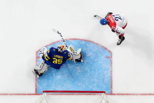 Jaroslav Chmelar of Czech Republic against  goaltender Carl