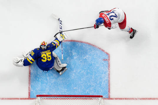 Jaroslav Chmelar of Czech Republic against  goaltender Carl