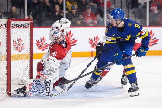 Ludvig Jansson of Sweden scores the 3-2 goal behind