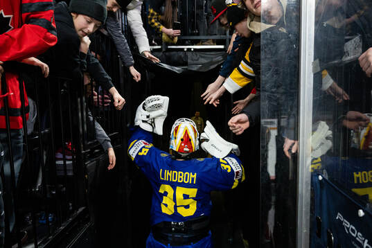Goaltender Carl Lindbom of Sweden celebrates