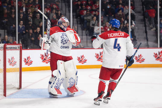Goaltender Tomas Suchanek and Jiri Tichacek of Czech