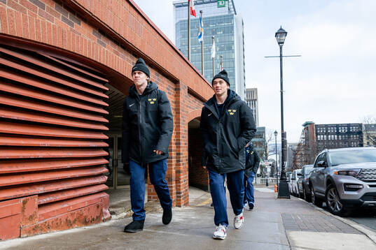 Jonathan Lekkerimäki and Noah Östlund of Sweden walk to