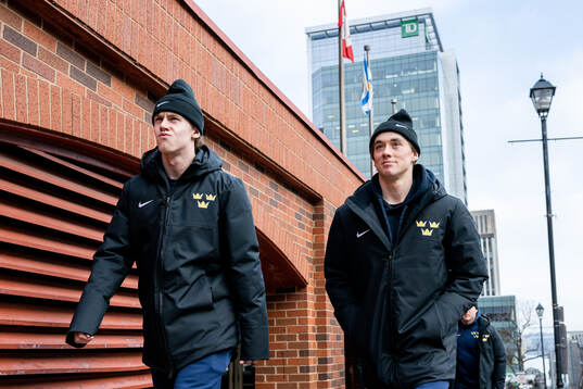 Jonathan Lekkerimäki and Noah Östlund of Sweden walk to