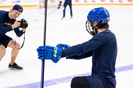 Simon Robertsson of Sweden takes photos of Axel