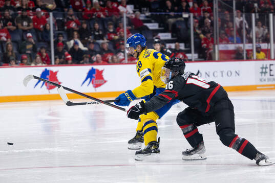 Simon Robertsson of Sweden and Connor Bedard of Canada