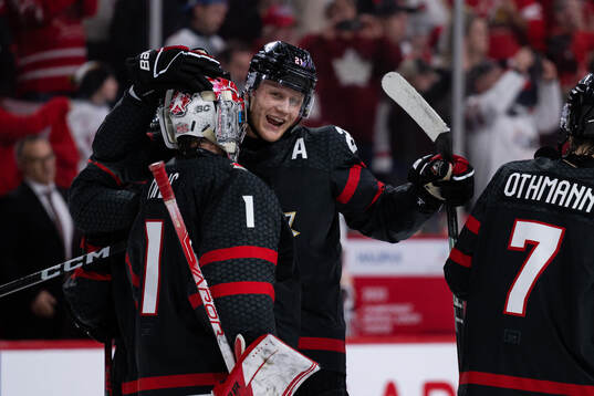 Goalkeeper Thomas Milic and Nathan Gaucher of Canada