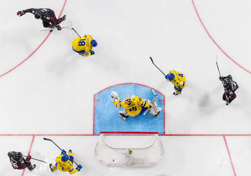 Joshua Roy of Canada scores the 1-0 goal behind Filip