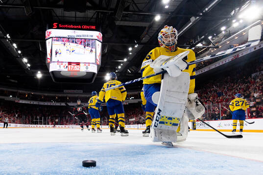 Goaltender Carl Lindbom of Sweden looks dejected
