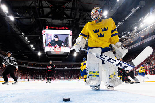 Goaltender Carl Lindbom of Sweden looks dejected