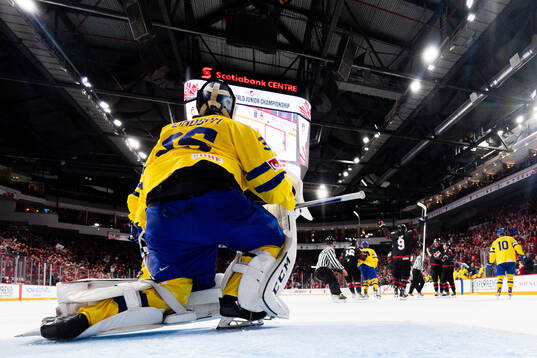 Goaltender Carl Lindbom of Sweden looks dejected