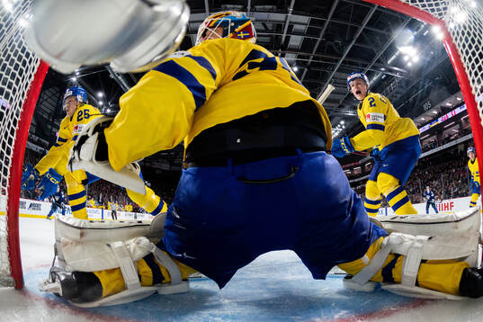 Milton Oscarson, Elias Pettersson and goaltender Carl