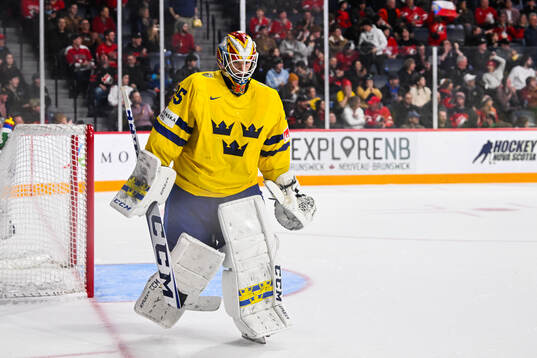goaltender Carl Lindbom of Sweden looks dejected