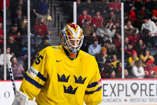 goaltender Carl Lindbom of Sweden looks dejected