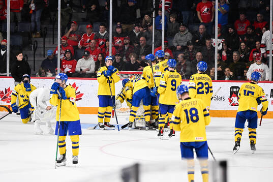 Players of Sweden look dejected