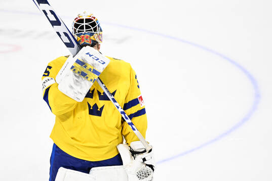 goaltender Carl Lindbom of Sweden looks dejected