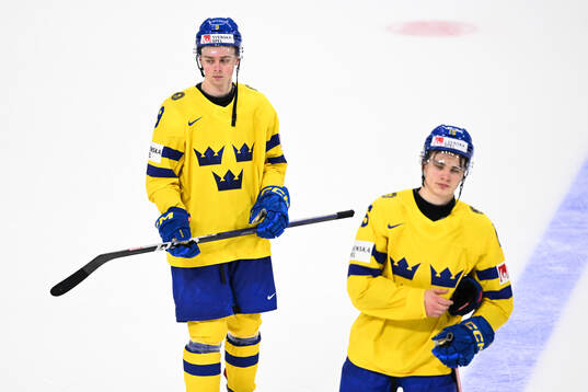 Ludvig Jansson and Jakob Norén of Sweden look dejected