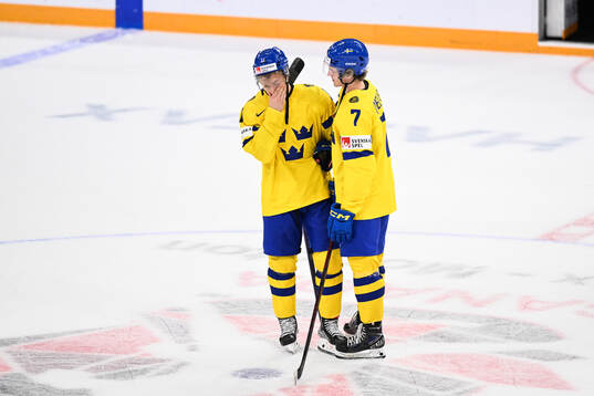 Fabian Lysell and Calle Odelius of Sweden look dejected