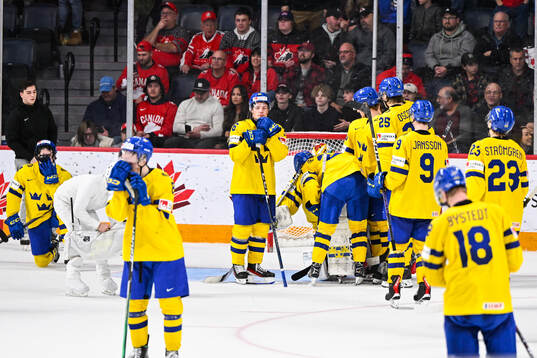 Players of Sweden look dejected