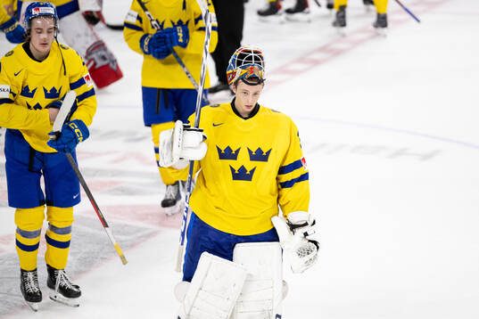 Goaltender Carl Lindbom of Sweden looks dejected