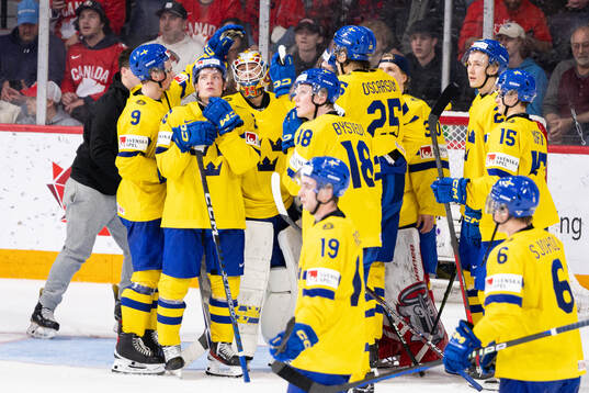 Players of Sweden look dejected