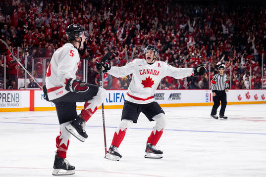 Brandt Clarke and Ethan Del Mastro of Canada celebrate the