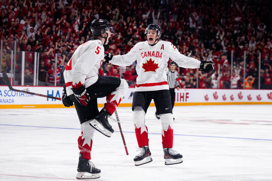 Brandt Clarke and Ethan Del Mastro of Canada celebrate the
