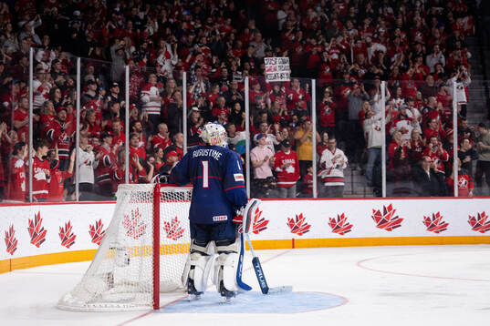 Goaltender Trey Augustine  of USA looks dejected