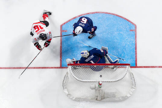 Connor Bedard of Canada scores the 2-1 goal  behind Ryan