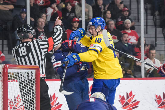 Filip Bystedt of Sweden in duel with Sean Behrens of USA