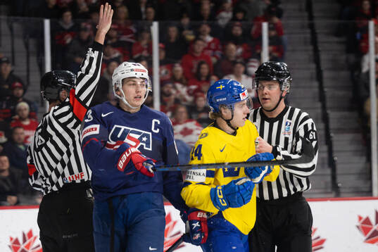 Luke Hughes of USA , Jonathan Lekkerimäki of Sweden and