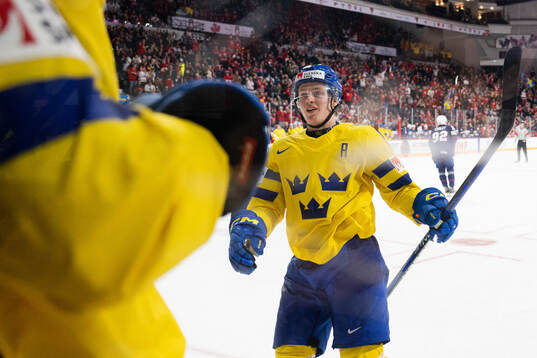 Victor Sjöholm of Sweden celebrates the 5-5 goal by Liam
