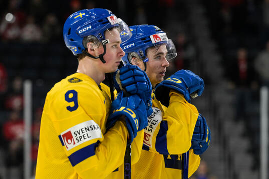 Ludvig Jansson and Isak Rosén of Sweden look dejected