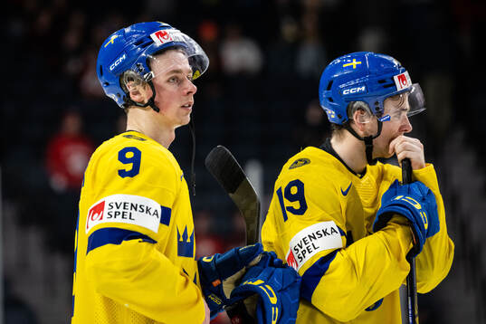 Ludvig Jansson and Isak Rosén of Sweden look dejected