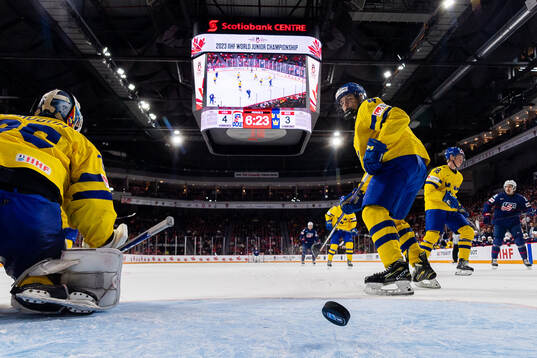 Goaltender Carl Lindbom and Axel Sandin-Pellikka of Sweden