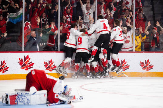 Players of Canada celebrate the game winning goal 2-3