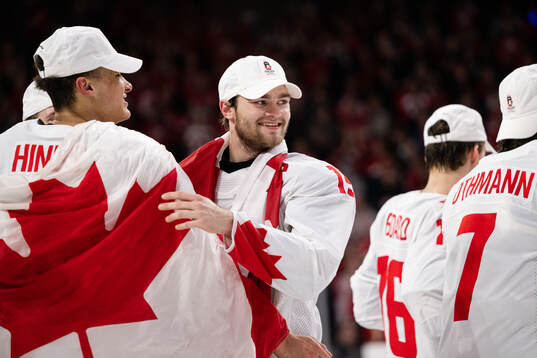 Shane Wright of Canada celebrates