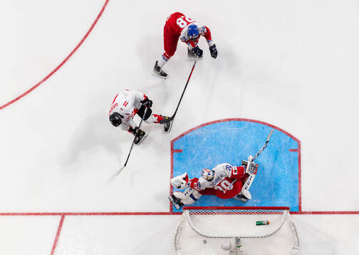Dylan Guenther of Canada scores the game winning goal 2-3