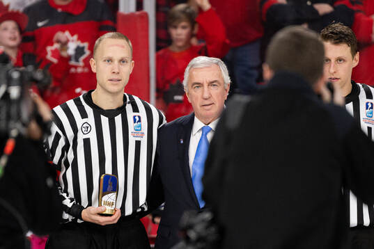 Referee Andreas Harnebring and Luc Tardif, President of the