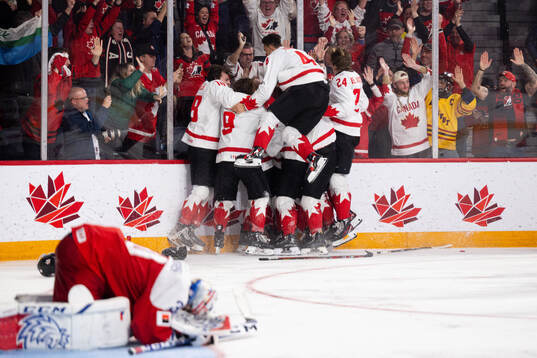Players of Canada celebrate the game winning goal 2-3