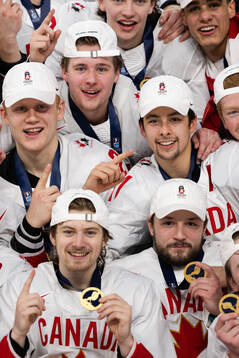 Players of Canada celebrate with their gold medals