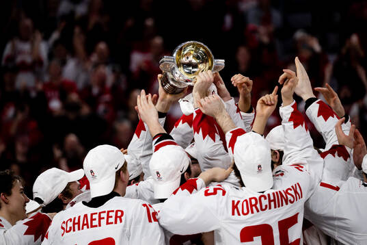Players of Canada celebrate with the trophy