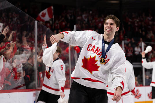 Adam Fantilli of Canada celebrates