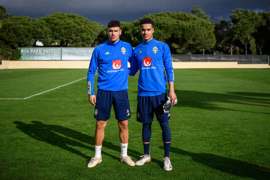 Edvin Kurtulus and goalkeeper Oliver Dovin of the Swedish