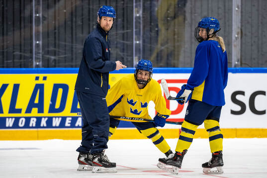 Goaltender coach Johan Ryman and Emma Rehn of Sweden at a