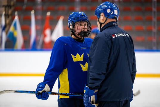 Jenna Raunio and assistant coach Ulf Hall of Sweden at a