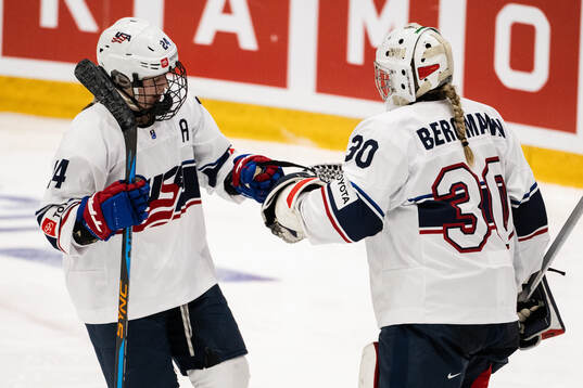 Margaret Scannell and goaltender Annelies Bergmann of USA