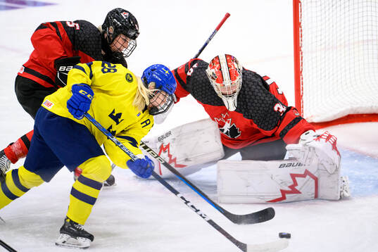 Moa Gustafsson of Sweden against goaltender Hannah Clark of