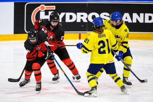Abby Stonhouse and Caitlin Kraemer of Canada and Emma Rehn